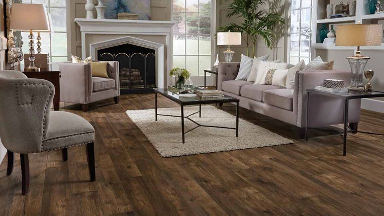wood look laminate floors in an elegant living room with a fireplace